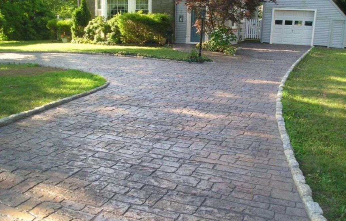Stamped decorative concrete driveway with cobblestone pattern